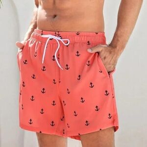 Brisira men's swim trunks with a coral color and navy blue anchor print